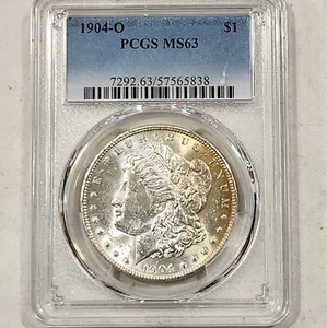 1904-O Morgan Dollar ~ PCGS MS63 ~ leggermente tonica Obv ~ $ 1 moneta d'argento USA - Foto 1 di 4