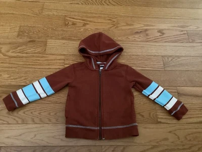 Sudadera con Capucha TEA COLLECTION BOY 2 Cremallera Óxido con Mangas Gráficas Aqua y Blanco Strioe - Usada en Excelente Condición Foto 1 de 4