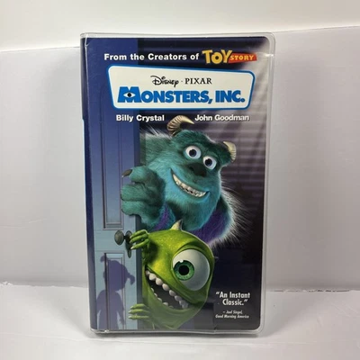Monsters, Inc. (VHS, 2002) Disney Pixar Clear Clam Shell Case & Blue Tape Foto 1 de 4
