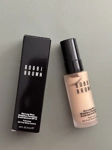 Base sin peso BOBBI BROWN Skin de larga duración SPF15 - Marfil cálido W-026 13 ml - Imagen 1 de 5