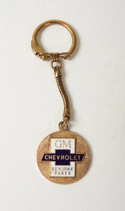 Llavero bronce esmaltado GM Chevrolet piezas genuinas (B3B-4) (JSF6) 1961 P&A revisión - Imagen 1 de 8