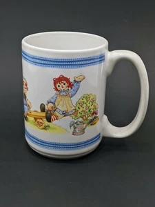 Raggedy Ann & Andy Dolls Outside Playing coffee Mug Cup 12 oz - Picture 1 of 6