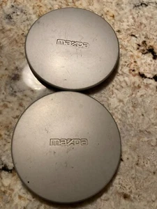(2) B457 / 7502 wheel center caps 90 Mazda Protege SE 323 - Picture 1 of 2