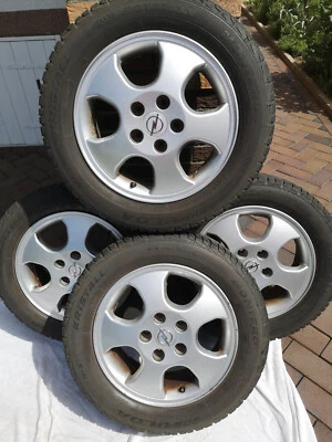 4 original Opel Alufelgen mit Winterreifen - Bild 1 von 4