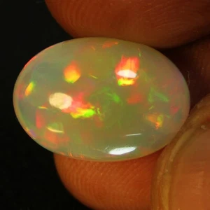 8,13 Karat natürliche Farbe spielen unbeheizter weißer Opal ovale Form Edelstein aus Äthiopien - Bild 1 von 5