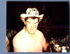 FOUND COLOR PHOTO K+3639 MAN IN HAT POSED AT TABLE
