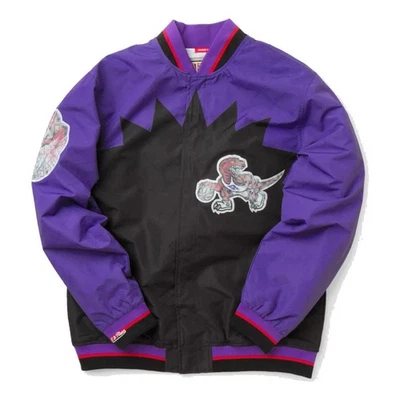 [OJBF1201-BANDEJA NEGRA] CHAQUETA DE CALENTAMIENTO MITCHELL & NESS 75 ANIVERSARIO RAPTORS para hombre Foto 1 de 2