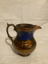Lovely Victorian Copper Lustre Pottery jug Blue floral band approx. 5 ins tall