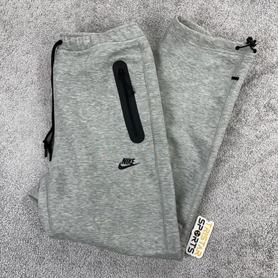 Pantalones deportivos Nike Tech polar para hombre gris medio calce estándar pantalones de pierna recta Foto 1 de 4