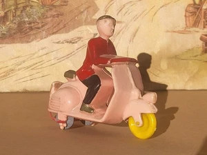 No tin toy (plastic) Grisoni-Italy Man On rose Vespa Scooter very good condition - Foto 1 di 10