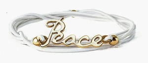 STAINLESS STEEL WHITE ENAMELED "PEACE" ON WHITE STRETCH CORD SLIP ON BANGLE - Picture 1 of 3