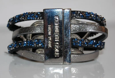 PULSERA KENNETH COLE ELEGANTE CADENA METAL FLUIDO GRANDE CUERO Y PLATA Foto 1 de 4