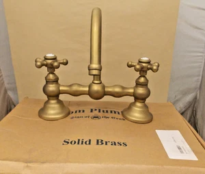 Strom Plumbing P0558-8 Columbia Bridge Lav. Grifo con drenaje de latón crudo sin lacar - Imagen 1 de 2