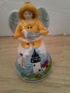 Fischer Engel Glocke Leuchtturm gelb Fischerhut und Mantel halten Möwe - Bild 1 von 6