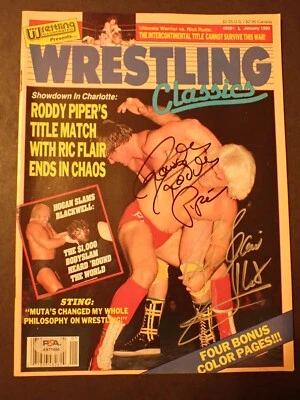 Rowdy Roddy Piper + Ric Flair PSA/DNA Vintage PWI 1990 Dual Signed Magazine Auto - Image 1 of 4