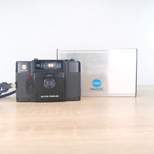 Cámara de bolsillo automática compacta Minolta AF-C 35 mm apuntar y disparar negra - Imagen 1 de 11