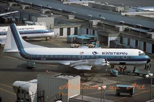 Eastern Airlines Lockheed L-188 Electra N5511 at DCA 8"x12" stampa a colori - Foto 1 di 1