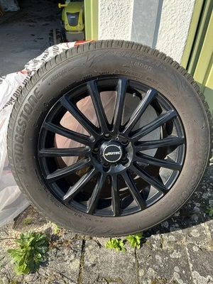 Winterreifen Bridgestone mit Autec Felgen  Schwarz  235/55 R17 103V  4 Stück - Bild 1 von 4