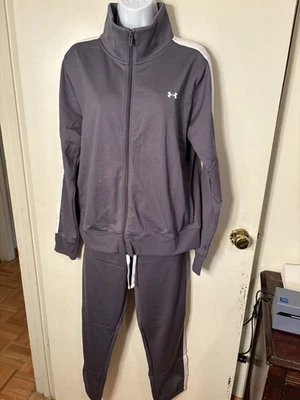 Nuevo con etiquetas Chándal para mujer Under Armour Tricot gris oscuro con rayas blancas talla mediana Foto 1 de 4