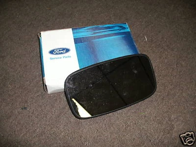 NOS 1987 - 1990 FORD TEMPO MIRROR GLASS REPLACEMENT - Image 1 of 2