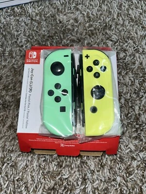 Genuine Oem Nintendo Switch Joy Con (L) Pastel Green  (R) Pastel Yellow W Strap - Image 1 of 3