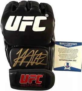 KHABIB NURMAGOMEDOV THE EAGLE SIGNED UFC GLOVE BECKETT BAS COA Z10057 - Picture 1 of 2