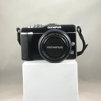 Cámara Olympus PEN E-PL 1 + Kit de lente de 14-42 mm y bolsa de cámara profesional Playstor azul Foto 1 de 4