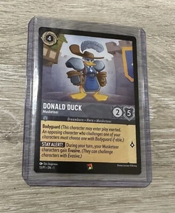 2023 Disney Lorcana Pato Donald Mosquetero Juego Alemania Tarjeta Promocional En Mano EE. UU. - Imagen 1 de 3