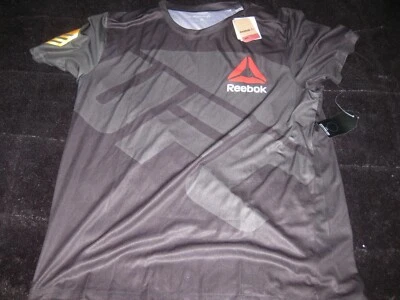 全新 Chris Weidman Reebok UFC Fight Kit 球衣 冠军 黑色 金色 T 恤 XL — 第 1/4 张图片