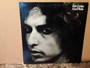 BOB DYLAN - HARD RAIN - VINYL LP - ROCK - 1976 - BOOK LISTED COLLECTABLE - VG - Picture 1 of 6