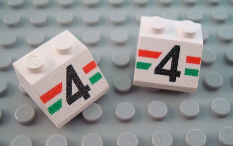 LEGO Lot of 2 White 2x2 City Racing 4 Decorated Slope Pieces - Image 1 of 1