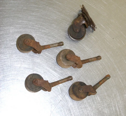 Set of four small wooden stem castors Wheels & 1 bolt on castor Cover