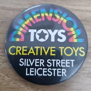 DIMENSION TOYS Creative Toys Silver Street Leicester Large Pin Badge 1970s Era - Picture 1 of 3