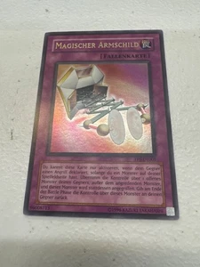 GERMAN - Magical Arm Shield TP8-EN001 - Tournament Pack Ultra Rare - NM - Picture 1 of 2
