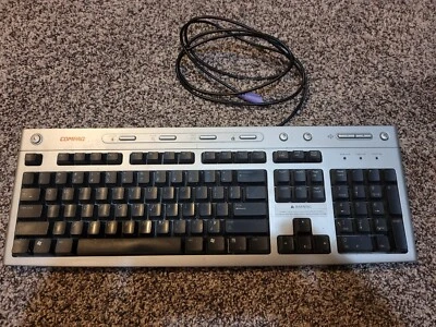 Teclado vintage Compaq con cable PS/2 5187-5023 plateado negro Foto 1 de 4