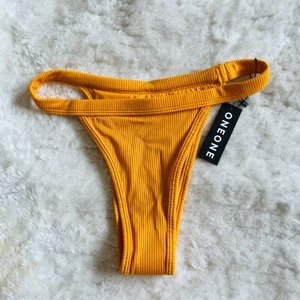 Neu mit Etikett Oneone Free People | Freche gerippte Bikinihose senfgelb gold | Gr. L - Bild 1 von 8