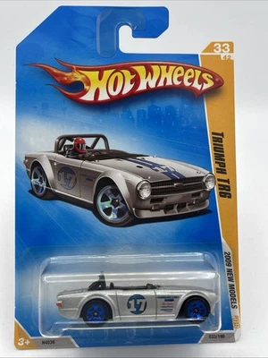 2009 Hot Wheels New Models Triumph TR6 33/42 Silver Blue Wheels - Image 1 of 4