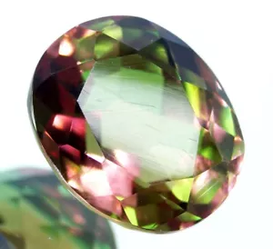Piedra preciosa suelta de corte ovalado con certificación GIE 21,15 quilates que cambia de color - Imagen 1 de 9