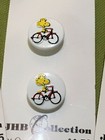 Collectable set Peanuts buttons woodstock snoopy bike plastic JHB Collection