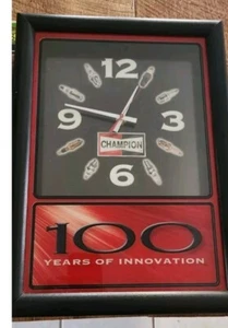 VINTAGE CHAMPION SPARK PLUG WALL CLOCK "100 YEARS OF INNOVATION" 16x11 1/2" - Picture 1 of 4