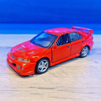 Coche fundido a presión Hongwell Cararama Mitsubishi Lancer Evolution Evo VI rojo escala 1:43 Foto 1 de 4