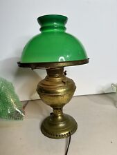 Antique New Juno oil lamp with cased green glass shade converted to electric