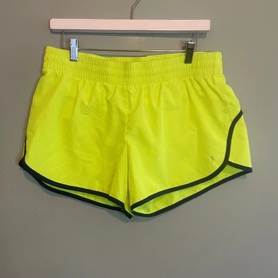 Shorts atlético feminino Danskin esporte corrida treinamento fitness academia amarelo grande - Imagem 1 de 4