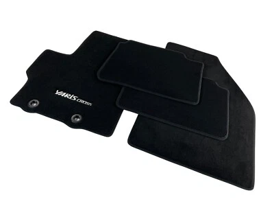 Alfombrillas cruzadas OEM Toyota Yaris terciopelo negro con logotipo tela de alfombra original Foto 1 de 4