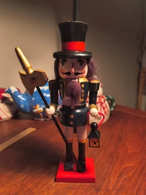 Vintage Holiday Wooden Nut Cracker Black,White accented In Gold, Red and Brown - Image 1 of 4