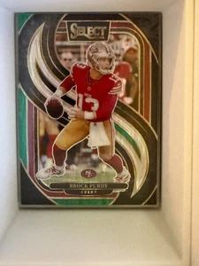2024 NFL SELECT FOOTBALL BLACK AND GREEN SHOCK BROCK PURDY #124 - Picture 1 of 1
