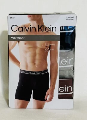 Nuevo paquete de 3 calzoncillos boxer de microfibra Calvin Klein negros, grises y borgoña, medianos Foto 1 de 3