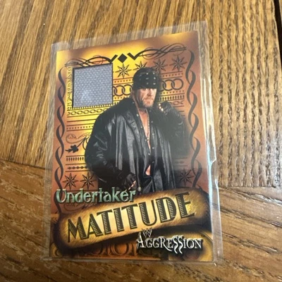 2003 Fleer WWE Aggression - Matitude Undertaker Mat Relic Raw Smackdown - Image 1 of 2