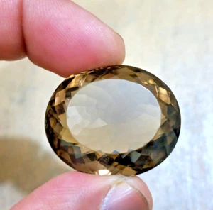 Atractiva piedra preciosa suelta de 100 quilates con forma ovalada facetada de cuarzo ahumado para joyería - Imagen 1 de 6