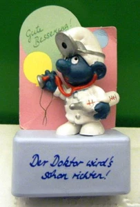 2.0037 GERMAN LANGUAGE DOCTOR SMURF ON RECTANGULAR STAND – VERY GENT USED - Picture 1 of 1